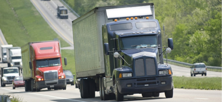vehicles-trucks-driving-on-highway